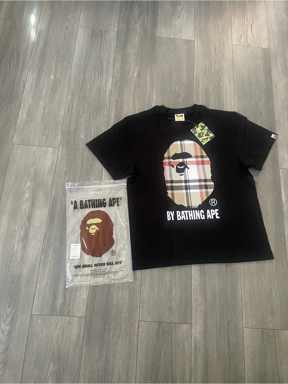 A Bathing Ape Black Logo Tee with Plaid Ape Graphic